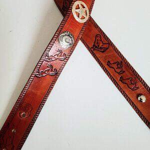 Handmaid McNeill leather belt Western design with horses and metal details.